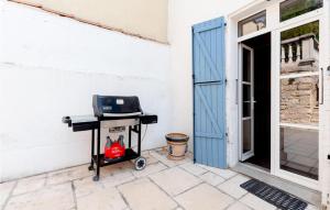 a table with a laptop on it next to a door at 4 Bedroom Lovely Home In Magalas in Magalas +17 photos