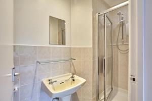 a bathroom with a sink and a shower at Howlyek, in St Agnes Village in St. Agnes  +10 photos