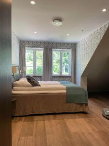 Postel nebo postele na pokoji v ubytování Hotell Eikerapen Gjestegård Åseral + 37 fotografií