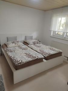Ένα ή περισσότερα κρεβάτια σε δωμάτιο στο Ferienwohnung Martin