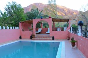 a villa with a pool and a gazebo at Dar Ayour Todra Gorges in Aït Baha