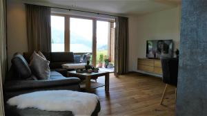 TV a/nebo společenská místnost v ubytování Appartements Plus