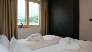 Postel nebo postele na pokoji v ubytování Appartements Plus + 37 fotografií