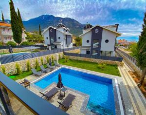 an image of a villa with a swimming pool at Nokta Life B Villa, Özel Havuzlu, Fethiye in Fethiye