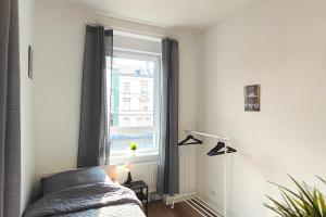 Postel nebo postele na pokoji v ubytování cozy apartments Offenbach