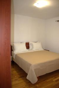 Postel nebo postele na pokoji v ubytování Apartments Granić