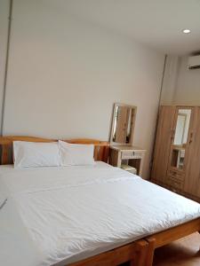 Postel nebo postele na pokoji v ubytování Sakura House