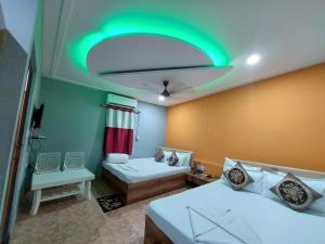 Llit o llits en una habitació de Megha Beach Resort - Sea View