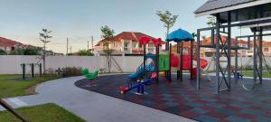 a playground in a backyard with a play set at Sunsky Condominium Homestay 2 in Miri
