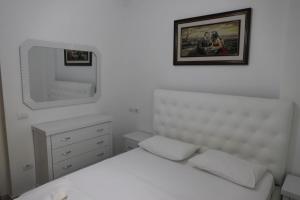 Giường trong phòng chung tại Gimi Apartments 2