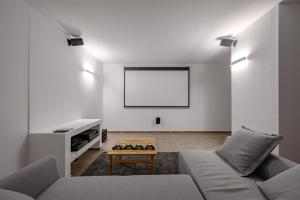 a living room with a couch and a table at La Villa Havgas in Elounda
