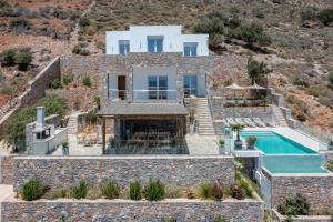 an image of a villa with a swimming pool at La Villa Havgas in Elounda