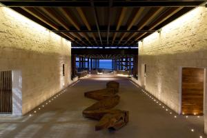 a hallway with wooden benches in a building at Grand Hyatt Playa del Carmen Resort in Playa del Carmen