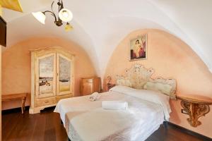 a bedroom with a white bed and a window at Centro Storico Rooms in Gallipoli