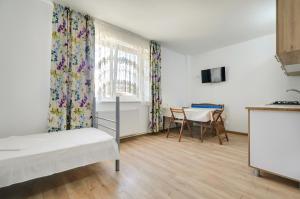 Postel nebo postele na pokoji v ubytování Vila Eliade