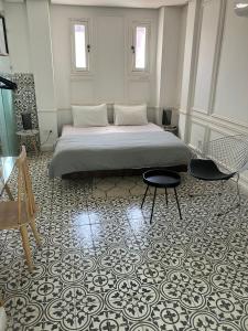 Postel nebo postele na pokoji v ubytování Riad Aïcha Kitchen
