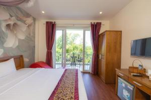 Postel nebo postele na pokoji v ubytování T&T Resort and Spa Phu Quoc
