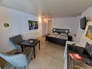 a living room with a couch and a table at Weingut Haxel in Cochem +17 photos