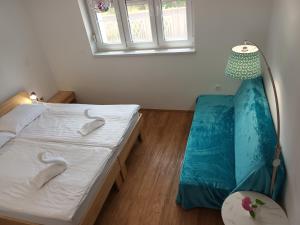 a bedroom with two beds and a window at Accommodation Baron in Ljubljana