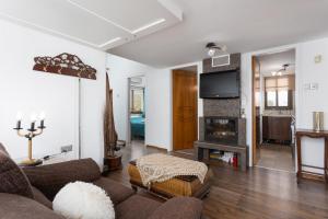 TV a/nebo společenská místnost v ubytování Villa Beach Heaven