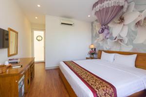Postel nebo postele na pokoji v ubytování T&T Resort and Spa Phu Quoc