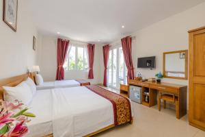 Postel nebo postele na pokoji v ubytování T&T Resort and Spa Phu Quoc