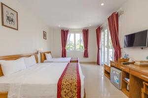 Postel nebo postele na pokoji v ubytování T&T Resort and Spa Phu Quoc