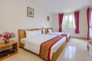 Postel nebo postele na pokoji v ubytování T&T Resort and Spa Phu Quoc