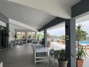 a large patio with chairs and a pool at Dela in Hvar