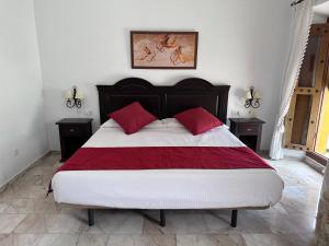 Łóżko lub łóżka w pokoju w obiekcie Hotel Bodega el Moral