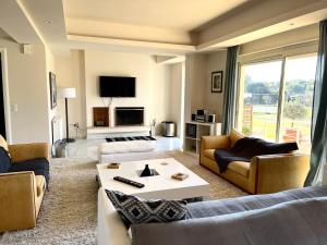 A television and/or entertainment centre at Legrena Beach Villa