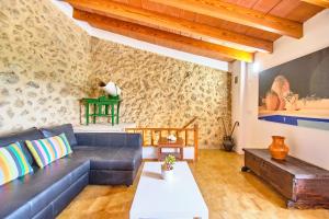 a living room with a couch and a table at Villa Son Bennassar in Inca