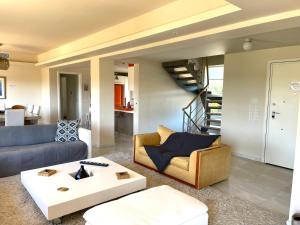 A seating area at Legrena Beach Villa