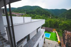 a view from the balcony of a building with a swimming pool at La Roby si Niko in Dubova