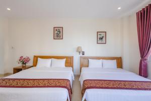 Postel nebo postele na pokoji v ubytování T&T Resort and Spa Phu Quoc