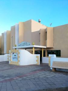 a building with a sign in front of it at FELIX HOUSE sea views in Costa de Antigua