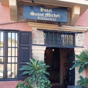 a building with a sign for a restaurant at Saint Michel Boutique Hotel in Rhodes Town