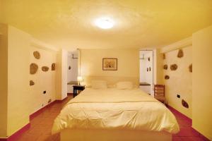Postel nebo postele na pokoji v ubytování El Alpendre de la Vega 4