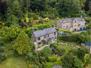 an aerial view of a large house with trees at Abbeville in Two Dales