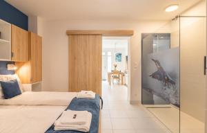 Posteľ alebo postele v izbe v ubytovaní Jégmadár & Fekete Gólya Apartmanok