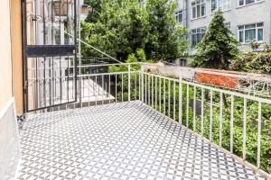 a balcony with a metal gate and a building at Studio Flat w Balcony Near Moda Shore in Kadikoy in Istanbul