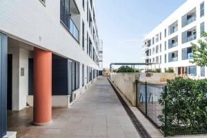 an empty hallway of a building next to a building at apartamento amplio en planta baja con terraza CALA BUSQUETS in Ciutadella