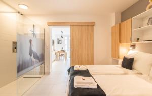 Posteľ alebo postele v izbe v ubytovaní Jégmadár & Fekete Gólya Apartmanok