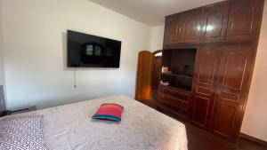 Katil atau katil-katil dalam bilik di Quarto aconchegante IV