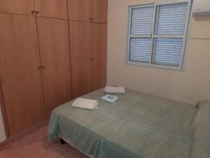 Una cama o camas en una habitación de Departamentos Niñas