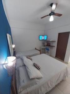 Postel nebo postele na pokoji v ubytování Pousada Brilho De Paraty