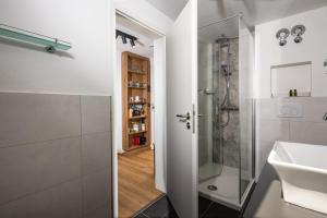 a bathroom with a shower and a sink at Hubertus Appartements Inzell in Inzell