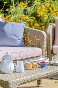 a table with a tray of food on top at Thurlestone Hotel in Thurlestone