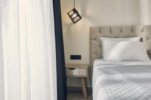 Cama ou camas em um quarto em Mouzaki's Stone Villas