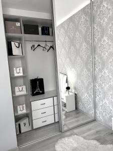 a dressing room with a mirror and a dresser at Luxurious Accommodation in Floreşti